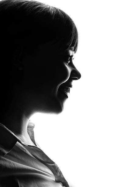 istock Dark colored profile of smiling woman 456520843