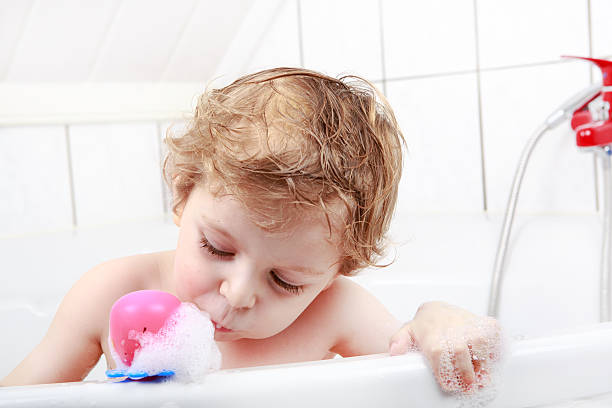 istock Adorable toddler boy having fun in bathtub 456533727