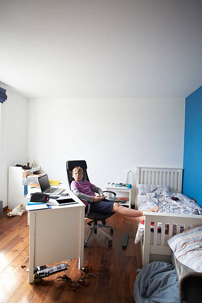 istock Boy Playing Video Game In Bedroom 456540931