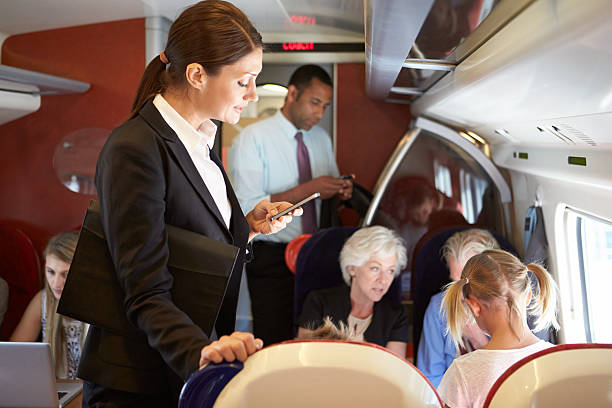 istock Businesswoman Using Mobile Phone On Busy Commuter Train 456544729