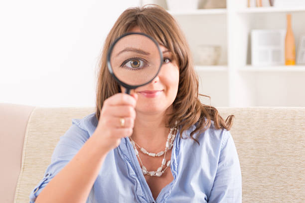 istock Beautiful woman with loupe 456566689