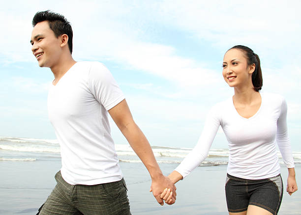 istock couple enjoying the beach 456573221