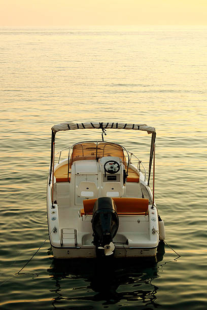 istock backside of motorized boat with sunset 456626779