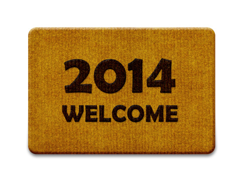 Happy new year 2014, welcome doormat carpet isolated on white. the same concept available for 2015 and 2016 year. (clipping path included)