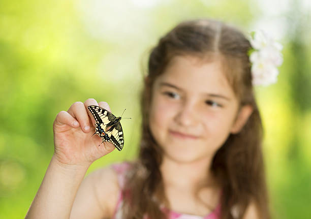 istock Girl with butterfly 456737513