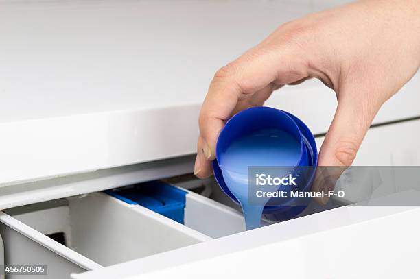 Hand Pouring Liquid Detergent Stock Photo - Download Image Now - Liquid, Fabric Softener, Laundry