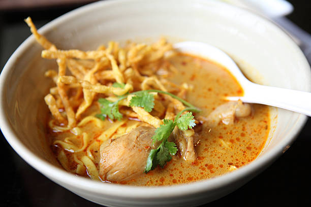 istock Noodle Khao soi , Thai food on wood background 456774281