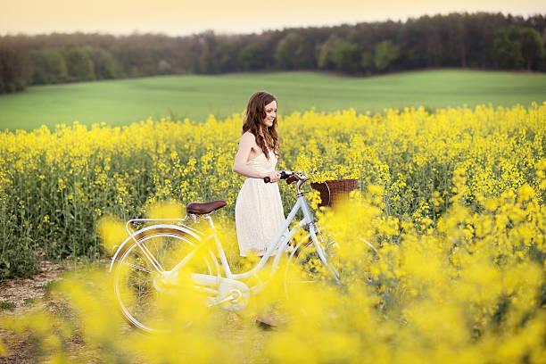 istock Young woman with bike 456790573