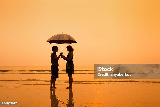 Family On The Beach Stock Photo - Download Image Now - Stability, Abstract, Adult