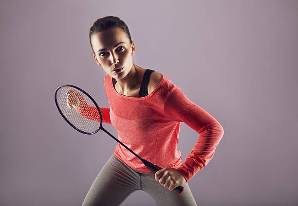 istock Beautiful girl playing badminton 456853531
