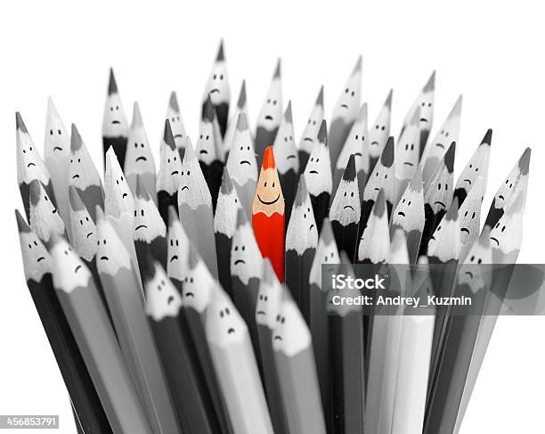 One Bright Color Smiling Pencil Among Bunch Sad Pencils Stock Photo - Download Image Now