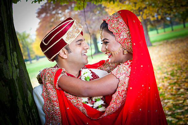 Young Asian couple in traditional dress stock photo