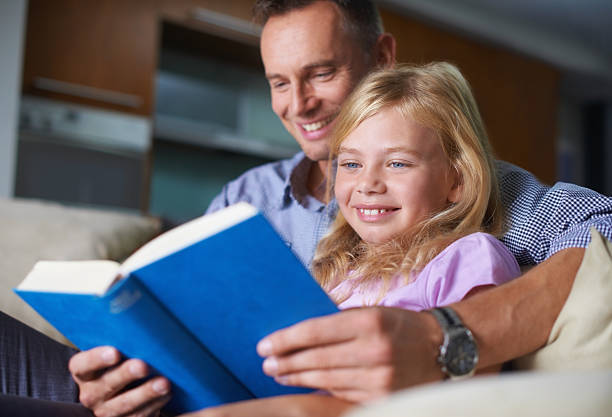 istock Father-daughter bonding over a good book 456858729