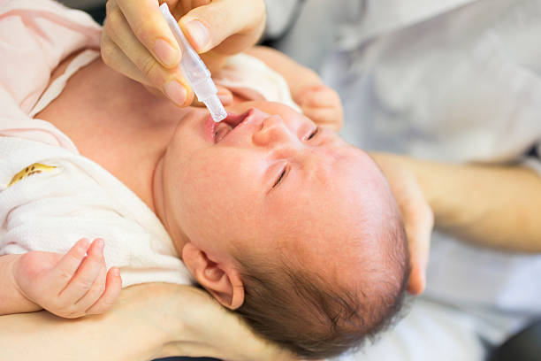 istock Baby Receiving Oral Vaccination 456862655