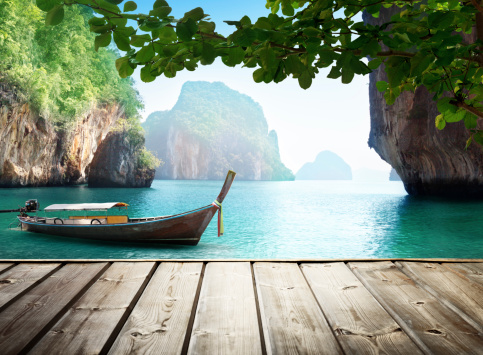 Adaman sea and wooden boat in Thailand