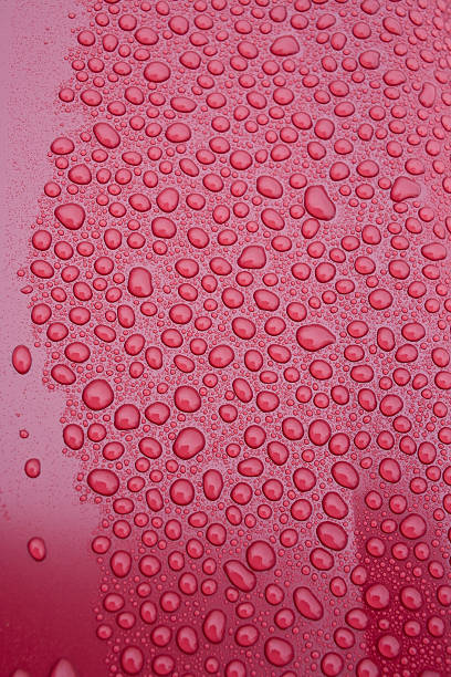 istock Drops of water on a red background 456865185