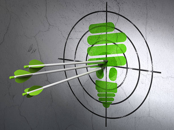 istock Business concept: arrows in Energy Saving Lamp target on wall 456866815