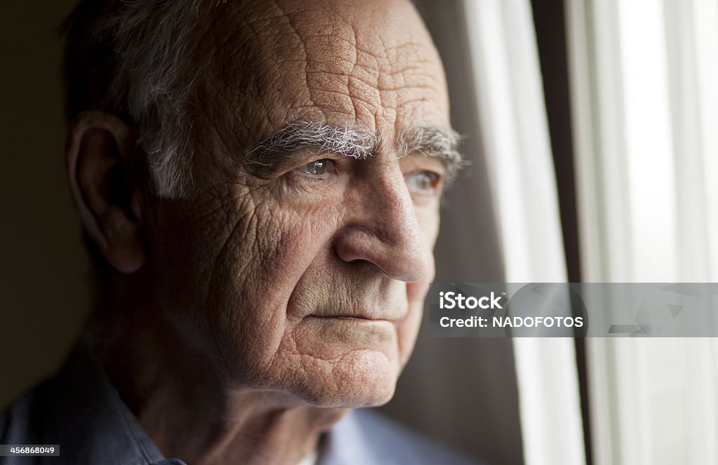 Portrait of Elderly man lost in thought Senior Adult Stock Photo