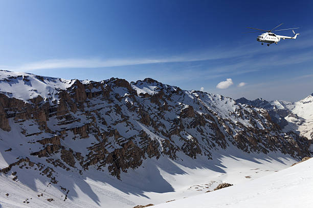 istock Helicopter in snowy sunny mountains 456881705