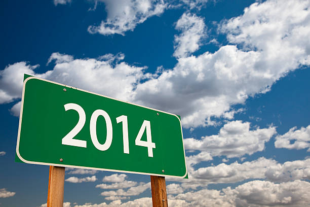 Green Road 2014 Sign Over Clouds