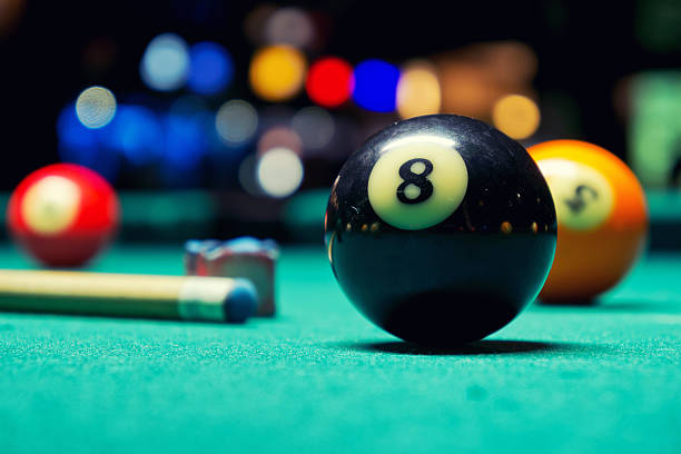 Billiard Balls A Vintage style photo from a billiard balls in a pool table. Noise added for a film effect pool break stock pictures, royalty-free photos & images