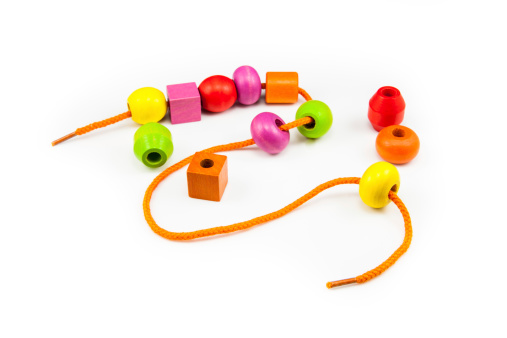 Wooden Beads on a String making a Colorful Toy Necklace