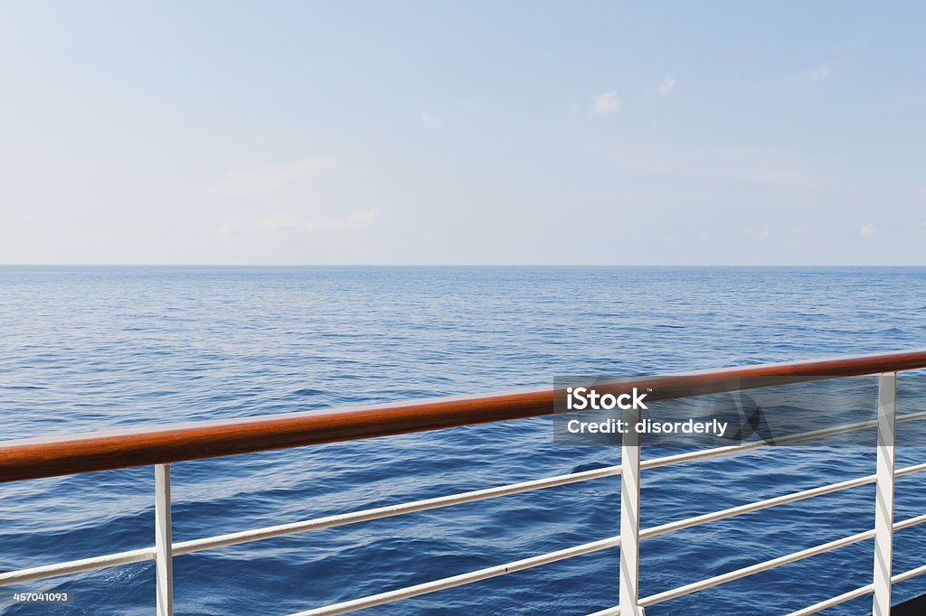 Cruising Looking at the sea from the deck of a cruise ship Railing Stock Photo