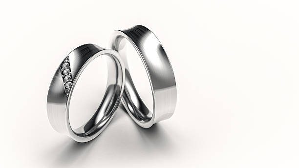 istock Pair of silver rings with small diamonds for lovers 457043207