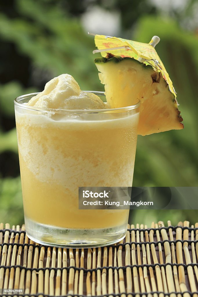 Pineapple Smoothie Fresh Pineapple Smoothie with slice of Pineapple Blended Drink Stock Photo