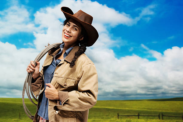 istock Cheerful cowgirl holding lasso 457050517