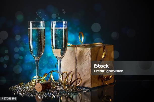 Two Champagne Glasses Stock Photo - Download Image Now - Alcohol - Drink, Anniversary, Blue