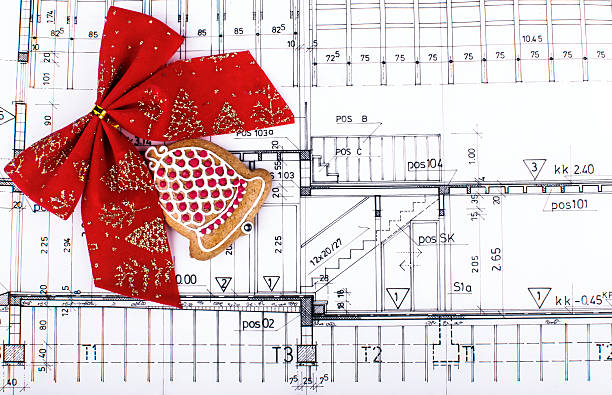 architect design blueprints and project drawings on table christmas background stock photo