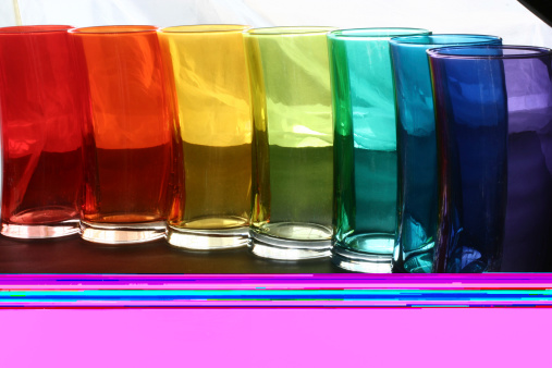 Artistically shaped glasses in rainbow of colors.