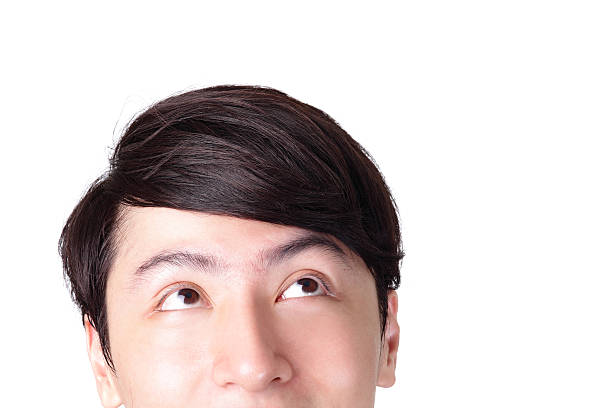 istock closeup of young man looking up 457080605