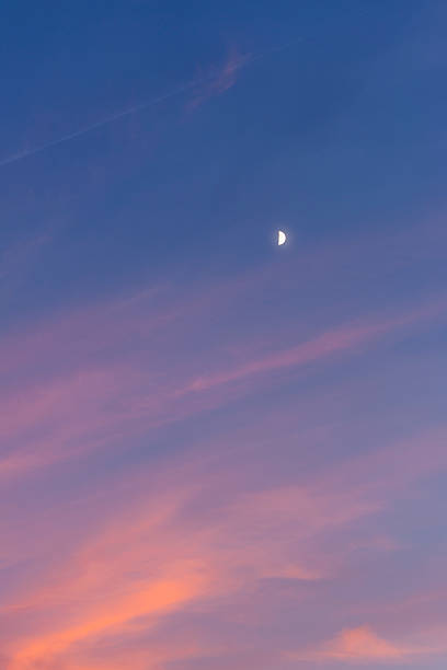 istock first quarter phase of the moon at beautiful sunset 457085735