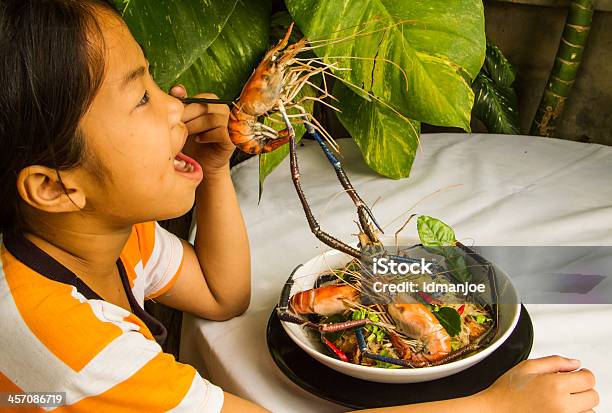 Asian Girl Eating Her Meal Stock Photo - Download Image Now - Appetizer, Asia, Child