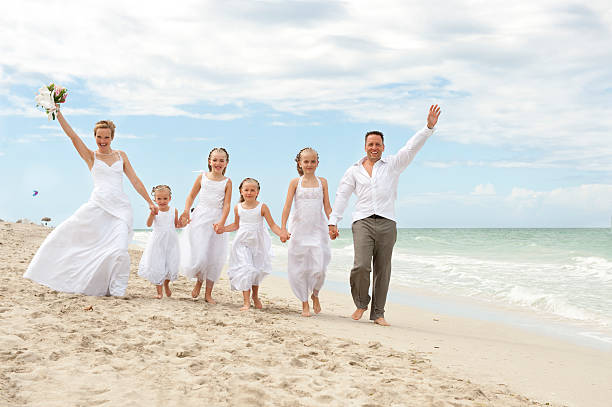 istock Beautiful couple with family on wedding day 457087621