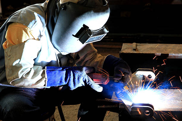 istock Industrial worker welding in factory 457096165