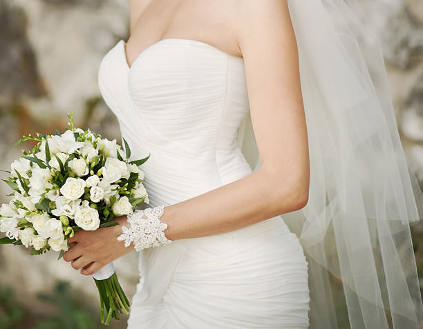 istock Caucasian bride holding wedding bouque 457097783