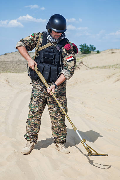istock soldier with metal detector 457099019