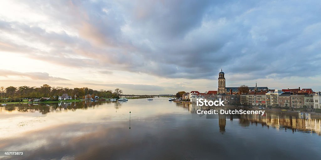 Panoramic river view of the Dutch historic city Deventer Panoramic view of the Dutch IJssel river with the historic city Deventer reflected in the water Deventer Stock Photo