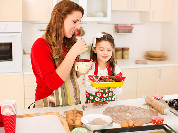 istock Mother and daughter making cookies. 457206561