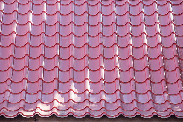 istock Red tiles roof background 457207349