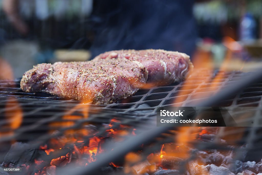 Steak Barbecue Seasoned steak on a barbecue grill Barbecue - Meal Stock Photo