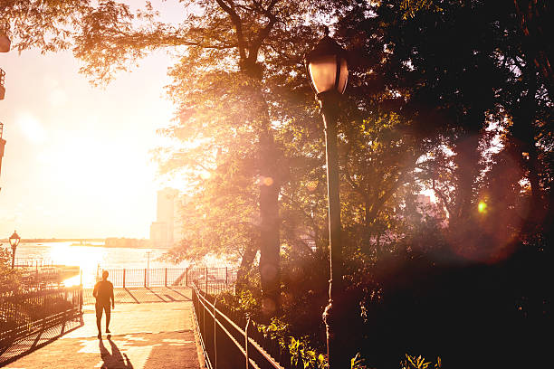 istock Man walking in the park 457208305