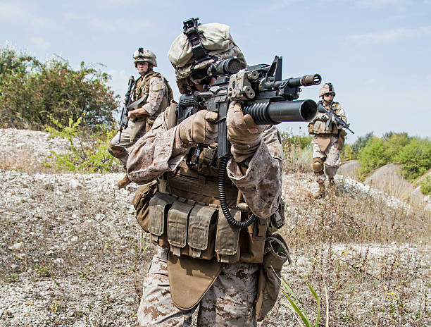 istock Soldier holding a gun in military operation 457215339