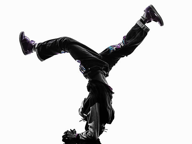 istock hip hop acrobatic break dancer breakdancing young man handstand 457217095