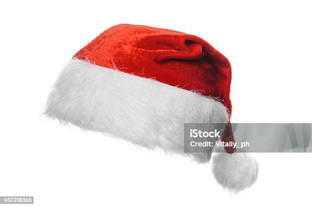 A Christmas Santa Hat On A White Background Stock Photo - Download Image Now - Knit Hat, Christmas, Santa Claus