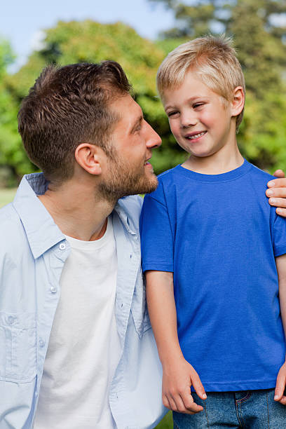 istock Smiling child looking at his father 457227233