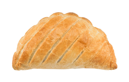 Traditional National Dish of Cornwall a Cornish Pasty isolated against a white background